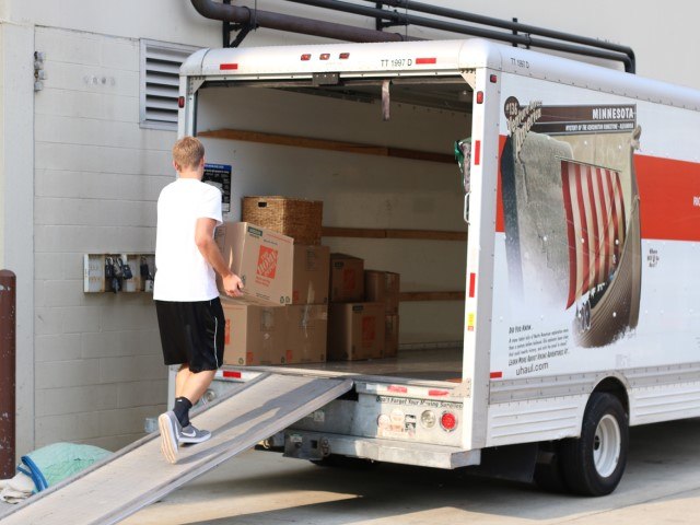 Mover in Dallas unloading a rental truck